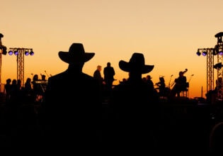 silouettes of crowd and performers at Festival of Outback Opera Singing In The Night event 2024