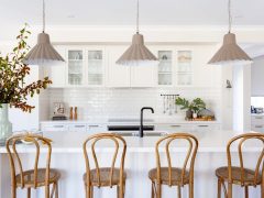 a modern kitchen interior with wooden chairs at Bridgewater
