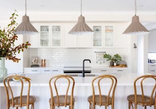 a modern kitchen interior with wooden chairs at Bridgewater