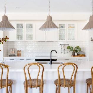 a modern kitchen interior with wooden chairs at Bridgewater