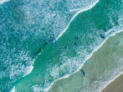 Aerial shot of surfers at Redgate Beach in Margaret River. (Image: Tourism Western Australia)