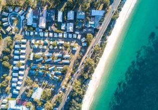 Aerial shot of Shoal Bay Holiday Park and Shoal Bay.