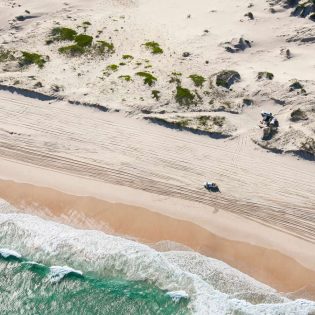 4WD driving along the beach on Worimi Conservation Lands, Port Stephens