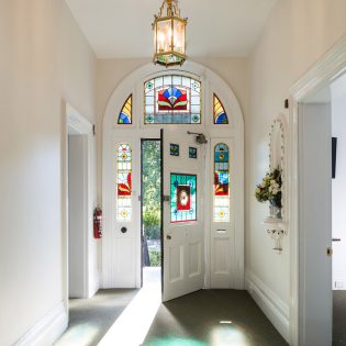 The front door with stain glass windows at The Florance.