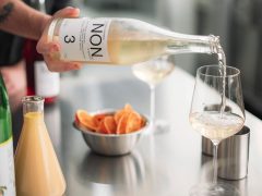 pouring NON 3 drink into a glass