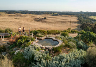 a couple heading towards a thermal pool at Peninsula Hot Springs