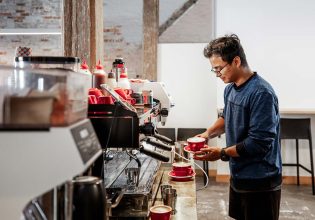 Barista making coffee at Bread + Butter Launceston