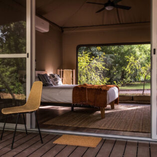 the bedroom interior inside the tent at Cooinda Lodge