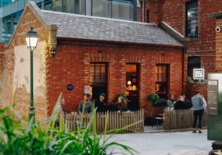 Patrons sit outside at Little Lon Distillery in Melbourne