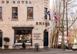A patron sits out front of the Lord Nelson Pub in The Rocks.