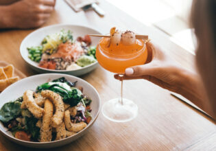 Couple enjoying a feast at Moku Bar & Grill in Cairns