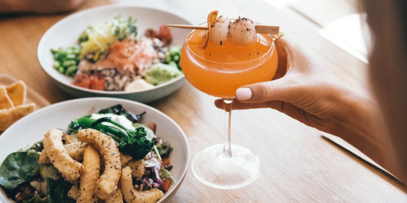 Couple enjoying a feast at Moku Bar & Grill in Cairns
