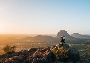 Standing at the top of Mount Ngungun at sunrise near Brisbane after hike