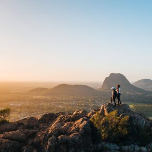 Standing at the top of Mount Ngungun at sunrise near Brisbane after hike