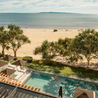 a beachfront swimming pool at Netanya Noosa