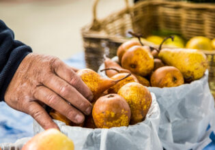 fresh pears available for purchase at the Orange Farmers Market.
