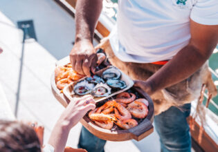 Guest enjoying bush tucker inspired canapes onboard a Saltwater Eco Tour