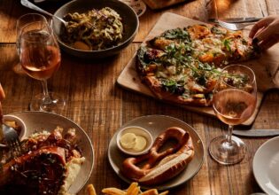 table spread of beer and food at The Haus Restaurant in Handorf South Australia